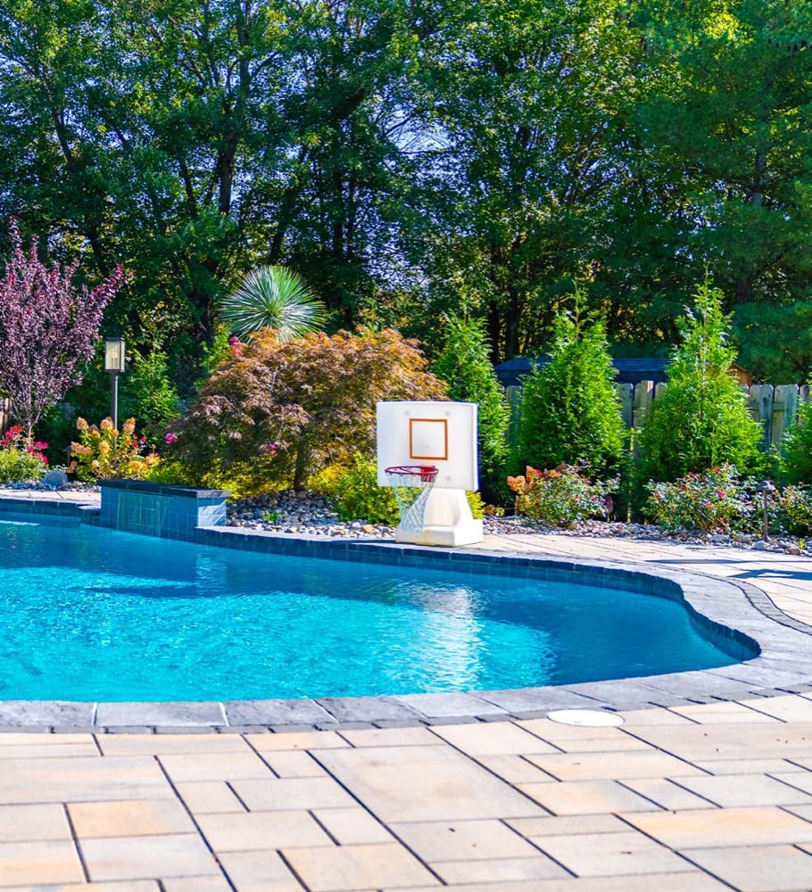 Pool with paver deck and landscaped garden