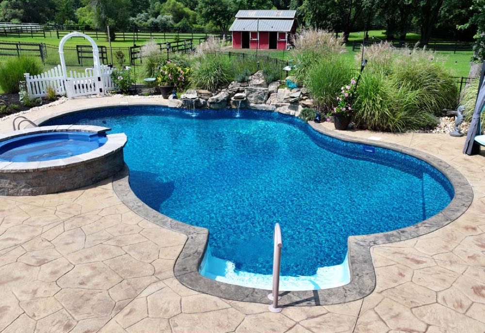 Free-form pool with attached raised spa